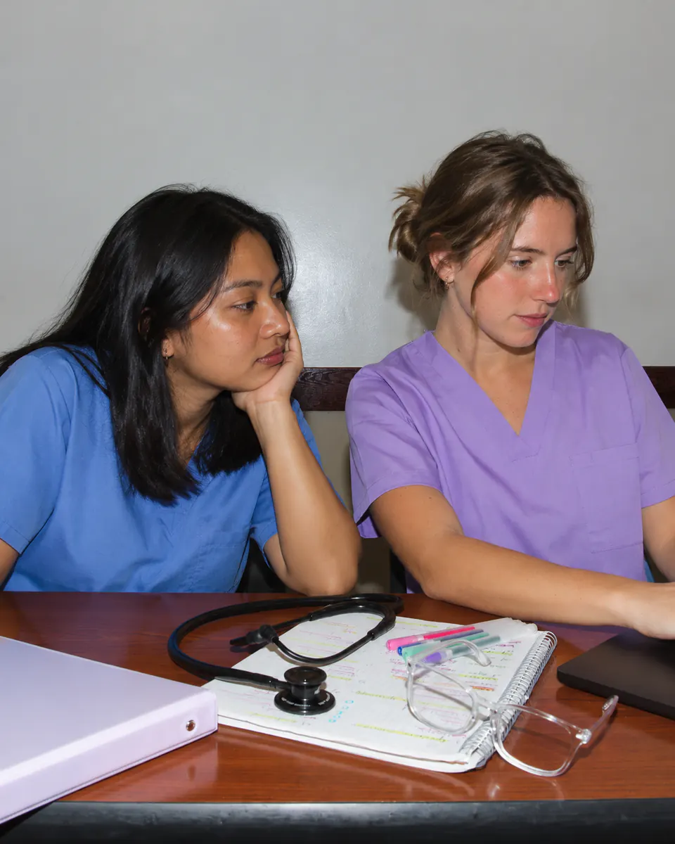 Two healthcare professionals working together at a table